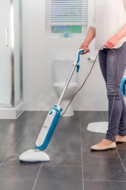 Russell Hobbs 1400W Steam & Clean Steam Mop & 5 Extra Mop Pads -Deals Russell Hobbs Store rhsm1001 g lifestyle high res 2 1